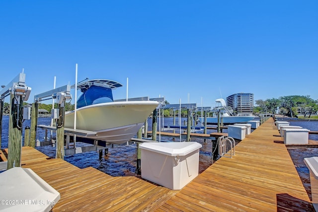 dock area featuring a water view and boat lift