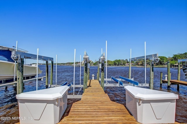 view of dock featuring a water view and boat lift