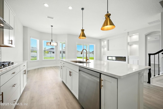 41 Iris Creek Dr, Saint Augustine, FL 32092 - kitchen with appliances with stainless steel finishes, light wood-type flooring, healthy amount of natural light, light countertops, and recessed lighting