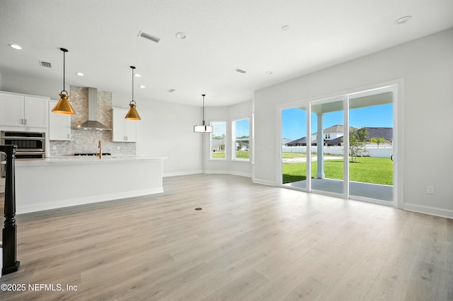 41 Iris Creek Dr, Saint Augustine, FL 32092 - unfurnished living room with recessed lighting and light wood-style flooring