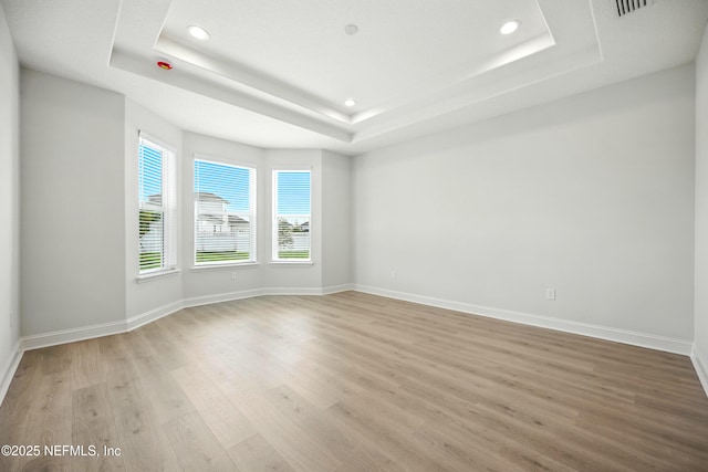 41 Iris Creek Dr, Saint Augustine, FL 32092 - spare room with recessed lighting, light wood finished floors, and a raised ceiling
