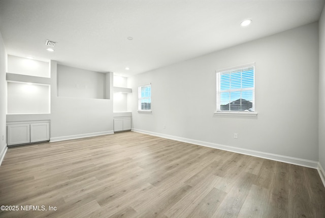 41 Iris Creek Dr, Saint Augustine, FL 32092 - empty room with light wood finished floors and recessed lighting