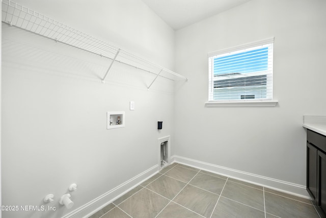 41 Iris Creek Dr, Saint Augustine, FL 32092 - laundry area with hookup for a gas dryer, hookup for a washing machine, tile patterned flooring, electric dryer hookup, and cabinet space