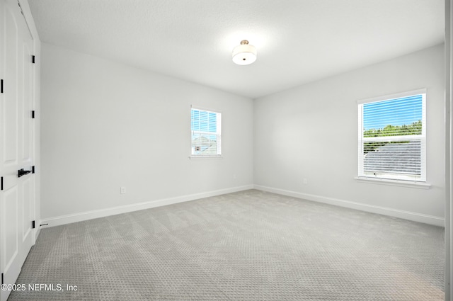 41 Iris Creek Dr, Saint Augustine, FL 32092 - unfurnished room with light carpet and plenty of natural light