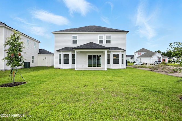 41 Iris Creek Dr, Saint Augustine, FL 32092 - rear view of property featuring a yard, a patio area, and a shingled roof