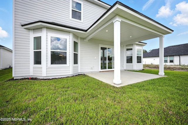 41 Iris Creek Dr, Saint Augustine, FL 32092 - rear view of house featuring a patio and a yard