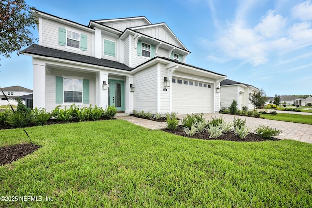 41 Iris Creek Dr, Saint Augustine, FL 32092 - view of front facade featuring board and batten siding, driveway, a front lawn, and a garage