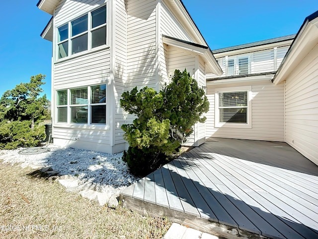 view of home's exterior featuring a deck