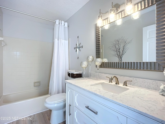 bathroom featuring shower / bath combination with curtain, toilet, a textured ceiling, vanity, and wood finished floors