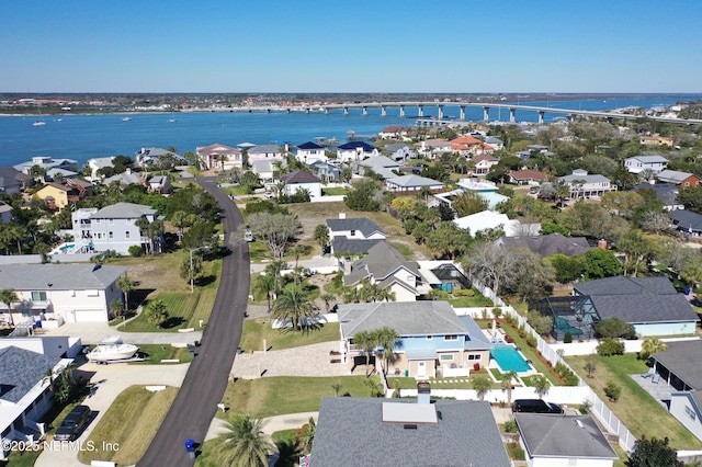 birds eye view of property featuring a water view and a residential view