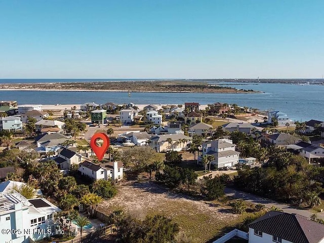 birds eye view of property featuring a water view and a residential view