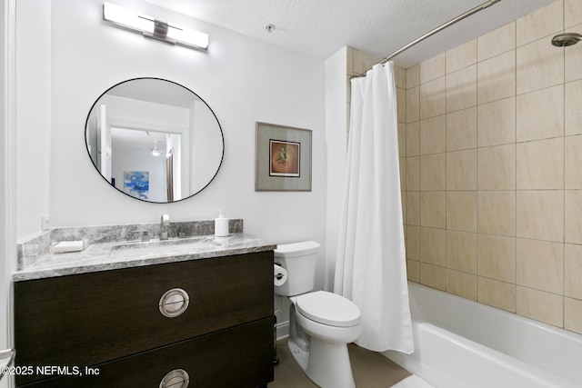 full bath featuring shower / bath combo with shower curtain, a textured ceiling, toilet, and vanity