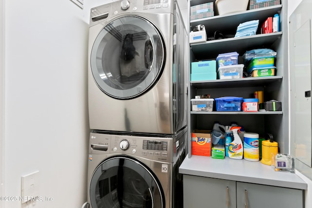 laundry area with laundry area and stacked washing maching and dryer