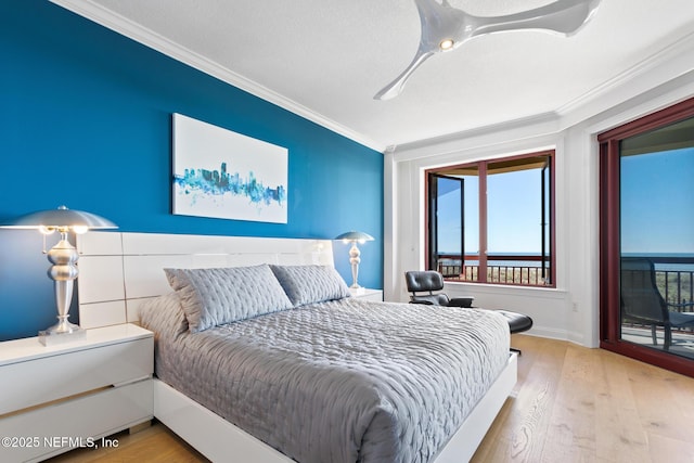 bedroom featuring ornamental molding, access to outside, baseboards, and wood finished floors