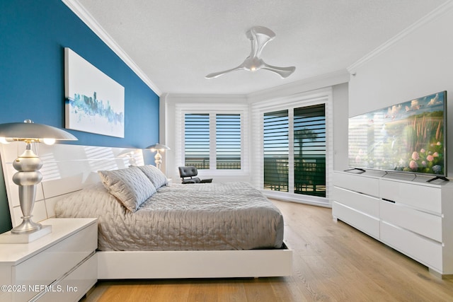 bedroom featuring multiple windows, light wood-style flooring, and crown molding