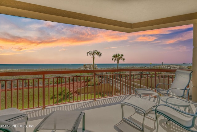 balcony at dusk with a water view