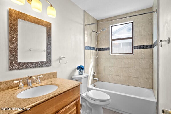 full bath with shower / bathing tub combination, vanity, and toilet