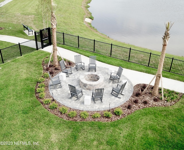 view of patio / terrace with a fenced backyard and a fire pit