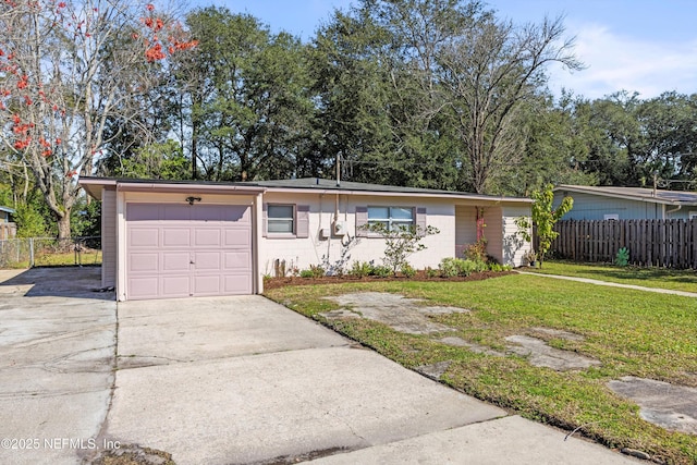 single story home with a garage, concrete driveway, a front yard, and fence