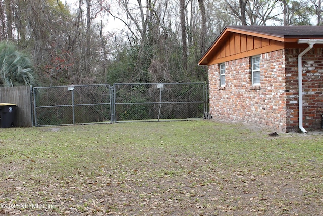 view of yard with a gate and fence