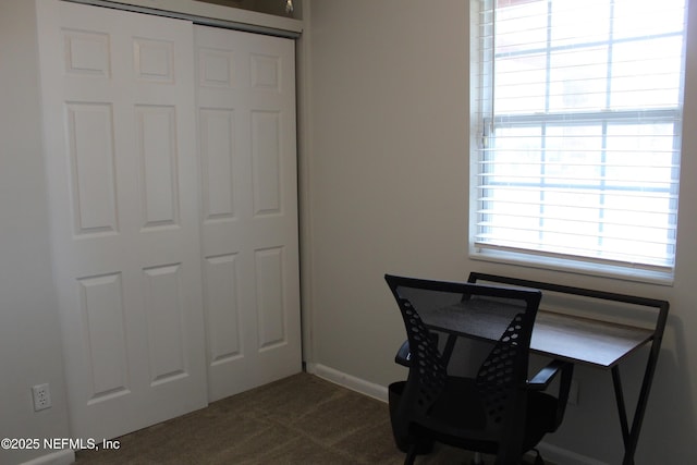 office area with dark colored carpet