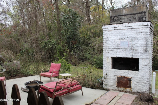 view of patio / terrace with an outdoor brick fireplace