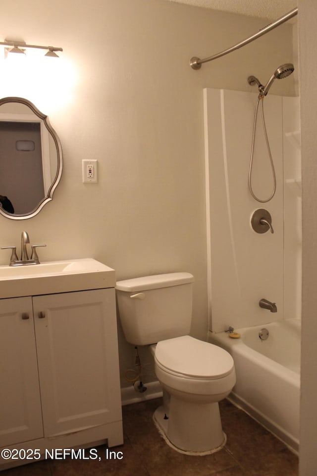 full bathroom featuring tile patterned floors, toilet, vanity, and shower / bath combination