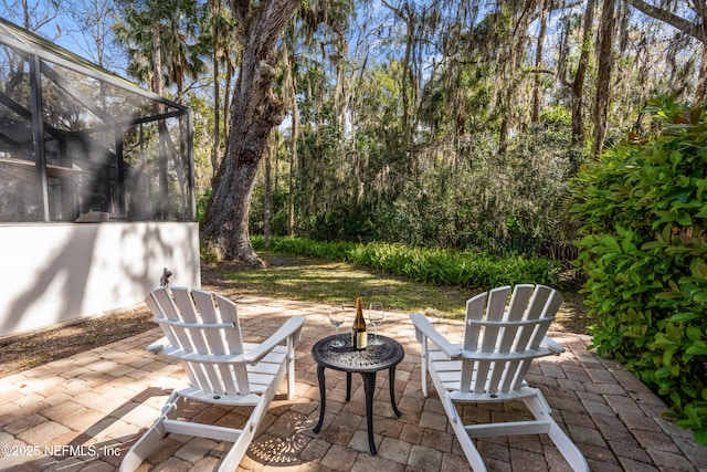 view of patio / terrace with a lanai