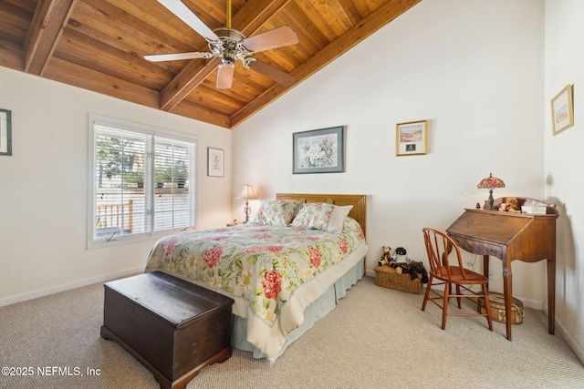 bedroom featuring vaulted ceiling with beams, wooden ceiling, a ceiling fan, baseboards, and carpet