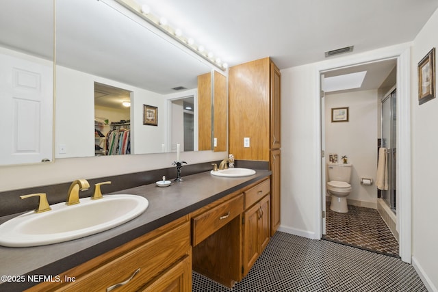 full bath with toilet, tile patterned flooring, visible vents, and a sink