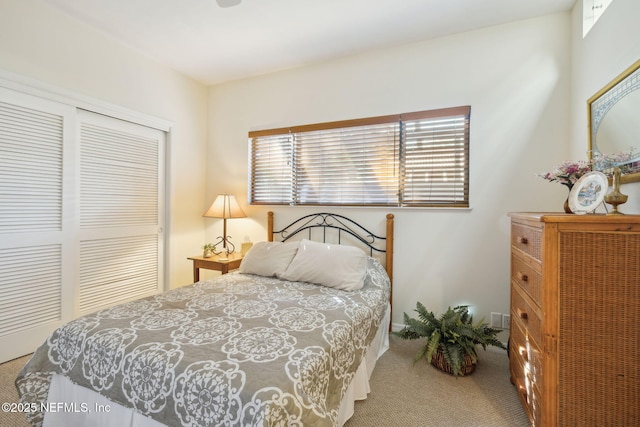 carpeted bedroom with a closet