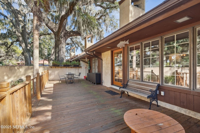 deck featuring outdoor dining area