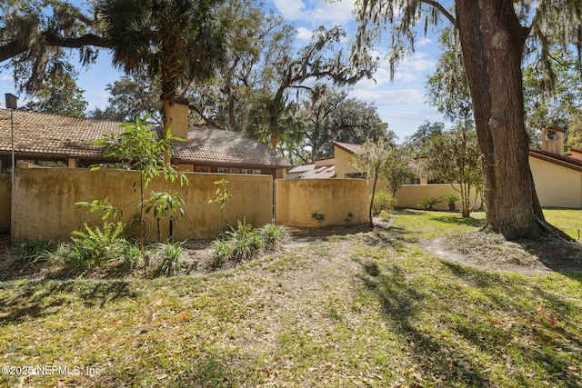 view of yard featuring fence