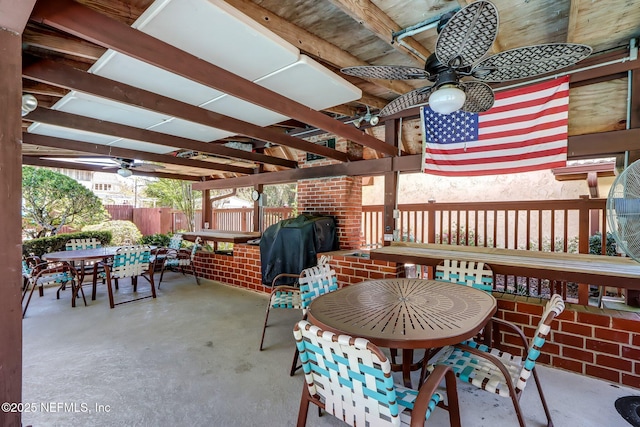 view of patio / terrace featuring ceiling fan, fence, area for grilling, and outdoor dining space