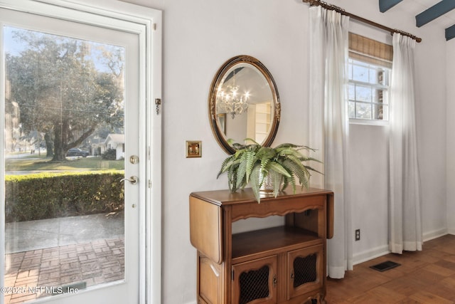 doorway to outside featuring visible vents