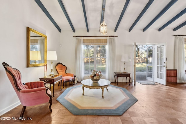 sitting room with lofted ceiling with beams