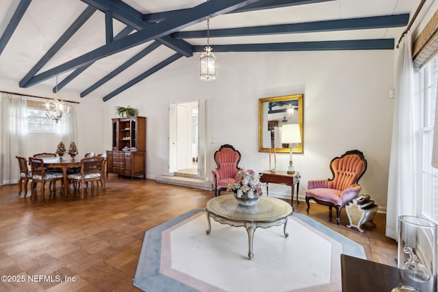 sitting room with vaulted ceiling with beams, baseboards, and an inviting chandelier