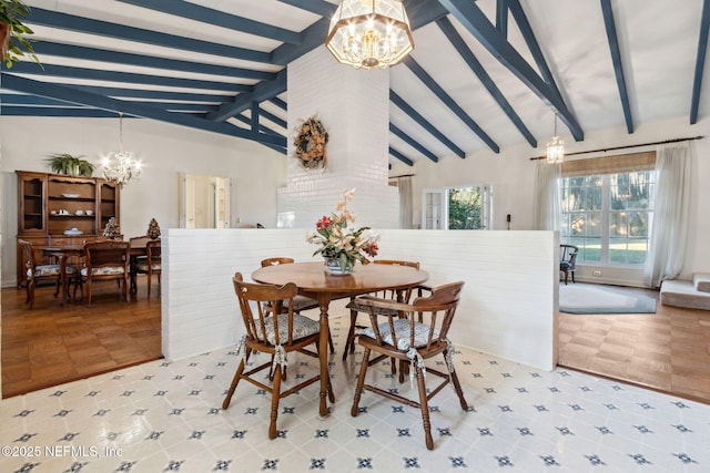 dining area featuring lofted ceiling with beams and a chandelier