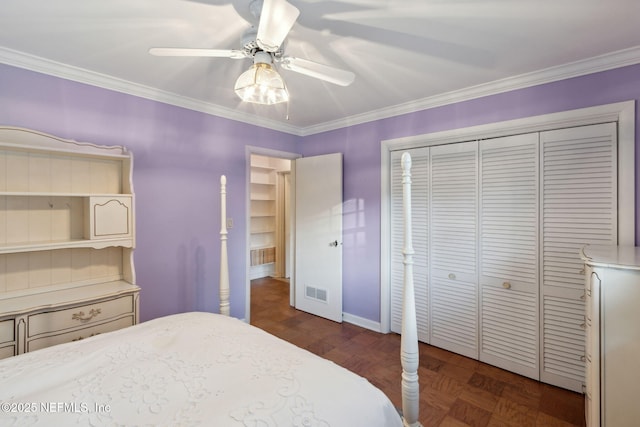 bedroom featuring ornamental molding, a closet, and visible vents