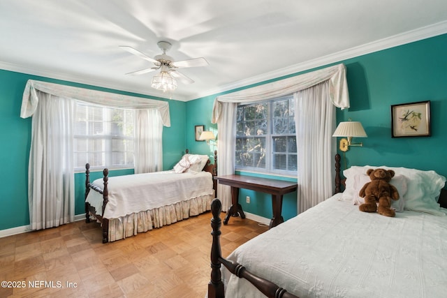 bedroom featuring baseboards, ceiling fan, and crown molding