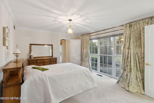 bedroom featuring ornamental molding, carpet flooring, and visible vents