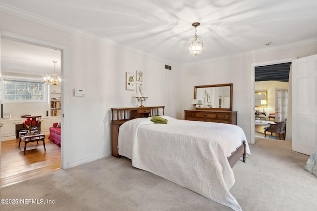 bedroom featuring baseboards, visible vents, light colored carpet, crown molding, and a chandelier