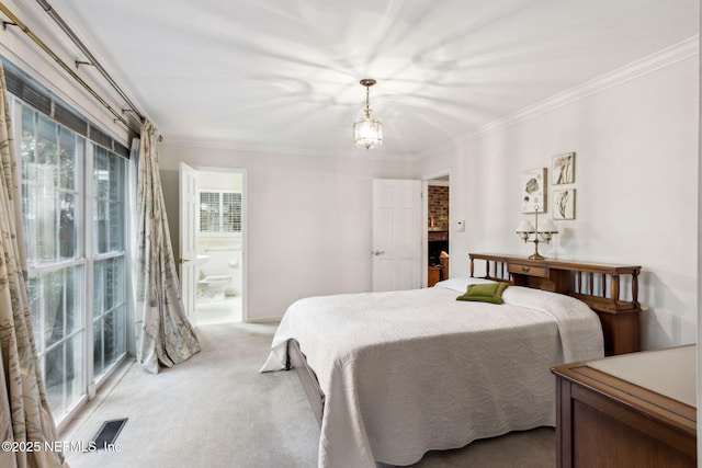 bedroom with light carpet, ornamental molding, ensuite bath, and visible vents