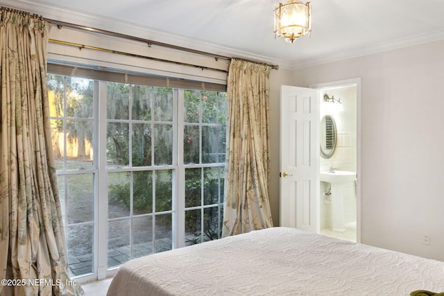 bedroom with ensuite bathroom and crown molding