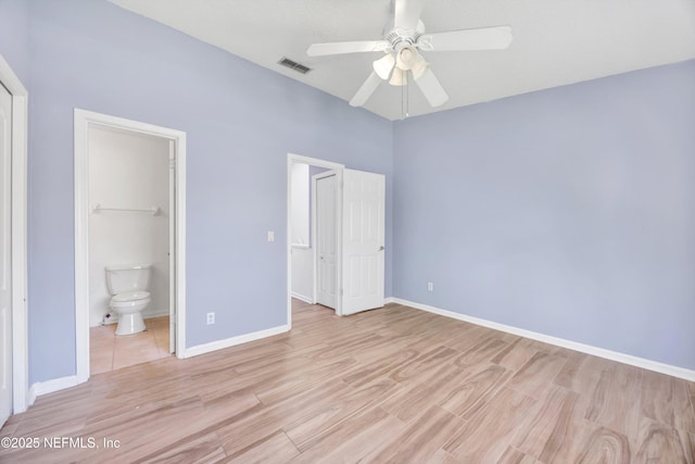unfurnished bedroom with visible vents, baseboards, light wood-type flooring, ensuite bathroom, and a ceiling fan