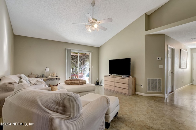 living room with lofted ceiling, ceiling fan, a textured ceiling, and visible vents