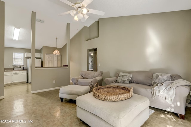 living area featuring light tile patterned floors, visible vents, baseboards, a ceiling fan, and high vaulted ceiling