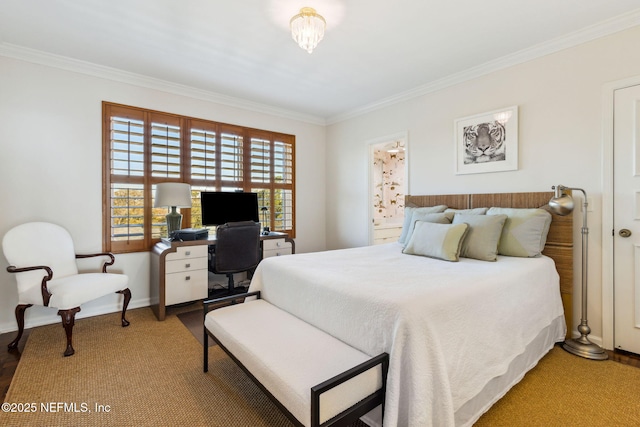 bedroom with baseboards, crown molding, and wood finished floors