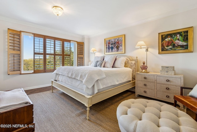 bedroom featuring dark wood-style floors, crown molding, and baseboards