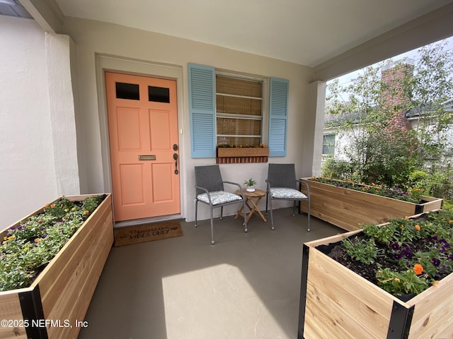 property entrance with stucco siding